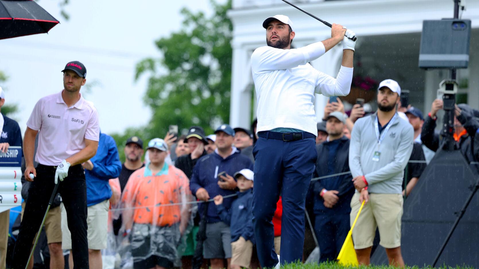 Scottie Scheffler hits an iron on tee box.JPG
